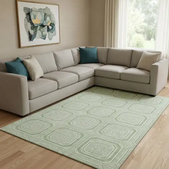 8' Mint Green And Ivory Geometric Washable Area Rug With UV Protection Photo 2
