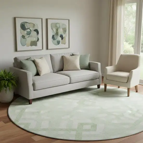 8' Mint Green And Ivory Geometric Washable Round Rug With UV Protection Photo 1