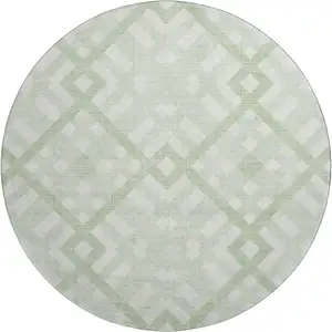 Photo of 8' Mint Green And Ivory Geometric Washable Round Rug With UV Protection