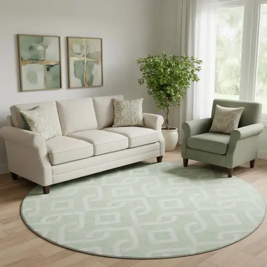 8' Mint Green And Ivory Geometric Washable Round Rug With UV Protection Photo 1