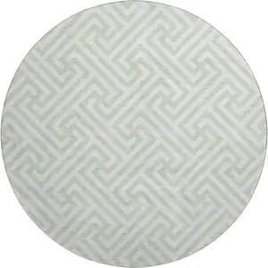 Photo of 8' Mint Green And Ivory Geometric Washable Round Rug With UV Protection