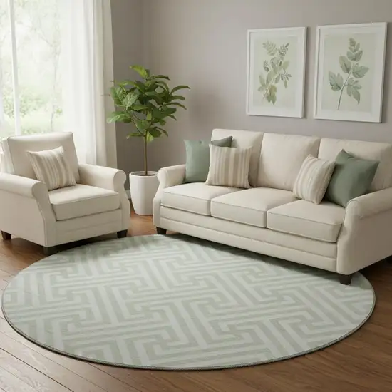 8' Mint Green And Ivory Geometric Washable Round Rug With UV Protection Photo 1
