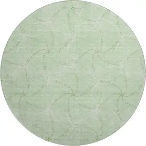 Photo of 8' Mint Green And Ivory Geometric Washable Round Rug With UV Protection