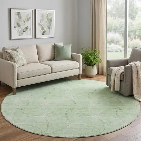 8' Mint Green And Ivory Geometric Washable Round Rug With UV Protection Photo 1