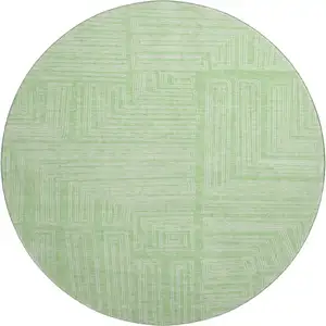 Photo of 8' Mint Green And Ivory Geometric Washable Round Rug With UV Protection
