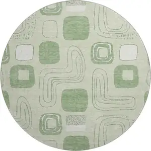 Photo of 8' Mint Green And Ivory Geometric Washable Round Rug With UV Protection