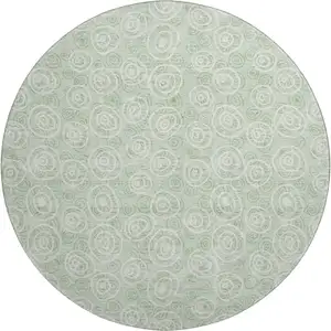 Photo of 8' Mint Green And Ivory Polka Dot Washable Round Rug With UV Protection