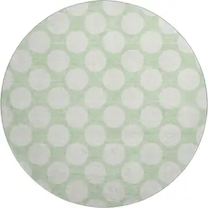 Photo of 8' Mint Green And Ivory Polka Dot Washable Round Rug With UV Protection