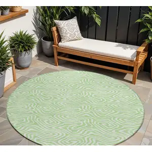 Photo of 8' Mint Green And Ivory Round Abstract Washable Indoor Outdoor Area Rug