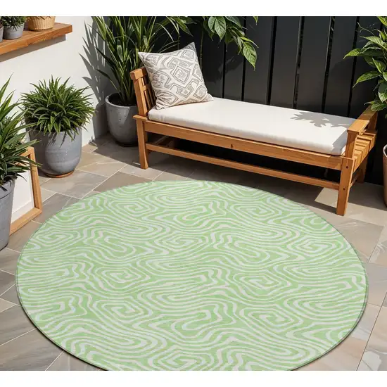8' Mint Green And Ivory Round Abstract Washable Indoor Outdoor Area Rug Photo 1