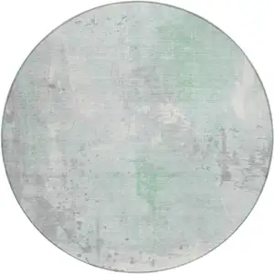 Photo of 8' Mint Green And Ivory Round Abstract Washable Indoor Outdoor Area Rug