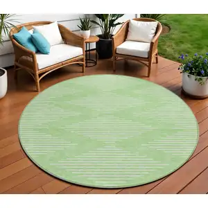 Photo of 8' Mint Green And Ivory Round Geometric Washable Indoor Outdoor Area Rug