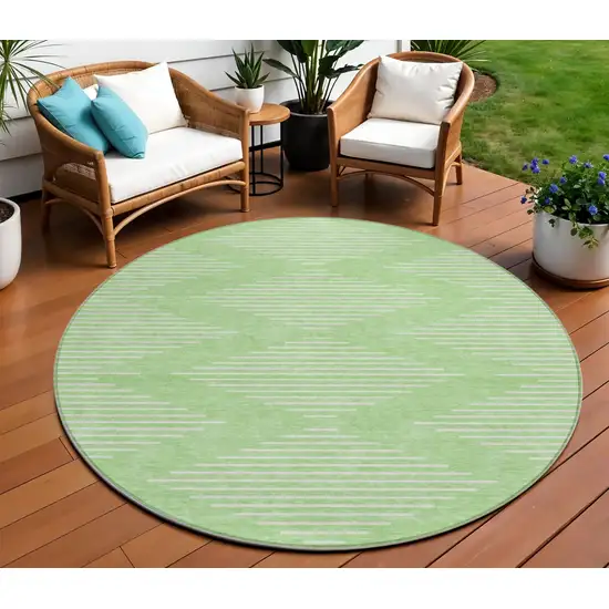 8' Mint Green And Ivory Round Geometric Washable Indoor Outdoor Area Rug Photo 1
