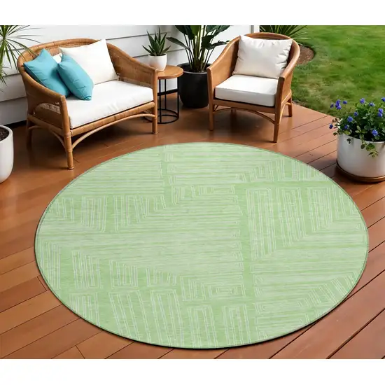 8' Mint Green And Ivory Round Geometric Washable Indoor Outdoor Area Rug Photo 1