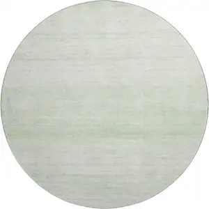 Photo of 8' Mint Green And Ivory Striped Washable Round Rug With UV Protection