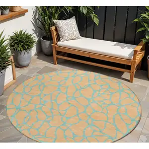 Photo of 8' Mint Green And Peach Round Geometric Washable Indoor Outdoor Area Rug