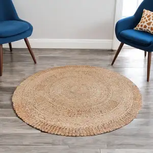 Photo of 6' Natural Jute Geometric Hand Braided Round Rug