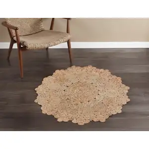 Photo of 4' Natural Jute Geometric Hand Braided Round Rug