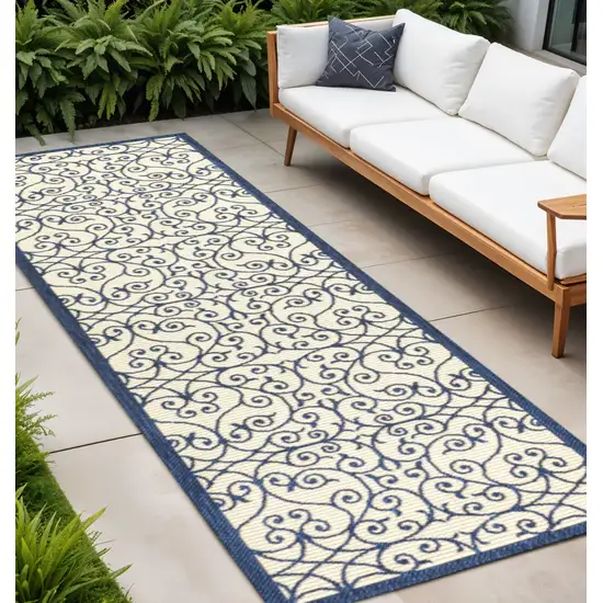 10' Navy Blue And Beige Geometric Indoor Outdoor Runner Rug Photo 1