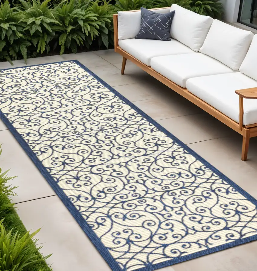 10' Navy Blue And Beige Geometric Indoor Outdoor Runner Rug Photo 1