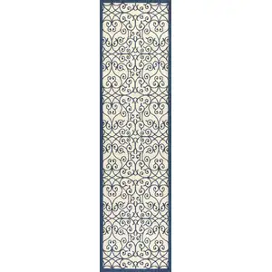 Photo of 10' Navy Blue And Beige Geometric Indoor Outdoor Runner Rug