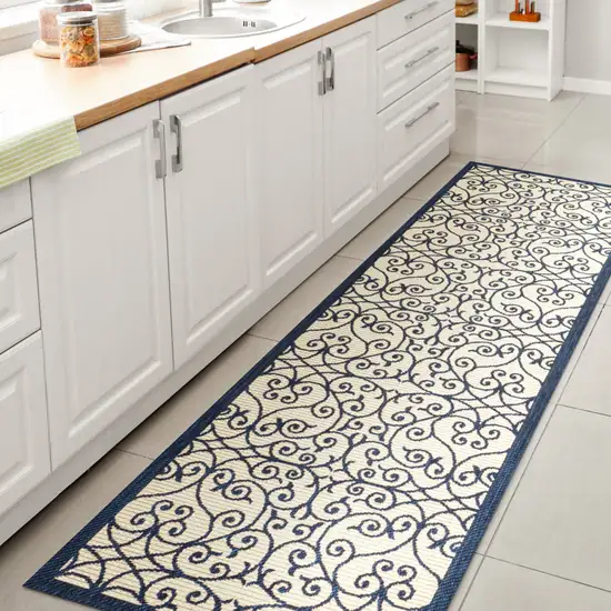 8' Navy Blue And Beige Geometric Indoor Outdoor Runner Rug Photo 6