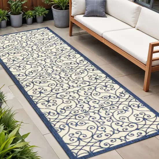 8' Navy Blue And Beige Geometric Indoor Outdoor Runner Rug Photo 1