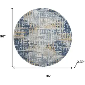 Photo of 8' Navy Blue And Beige Geometric Washable Round Rug With UV Protection