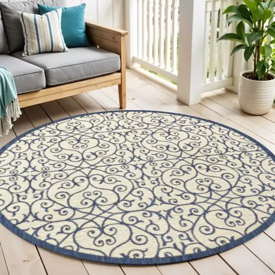 5' Navy Blue And Beige Round Geometric Indoor Outdoor Area Rug Photo 1
