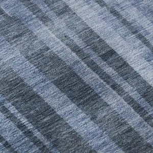 Photo of 8' Navy Blue And Denim Blue Striped Washable Round Rug With UV Protection