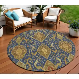 Photo of 8' Navy Blue And Gold Round Ikat Washable Indoor Outdoor Area Rug