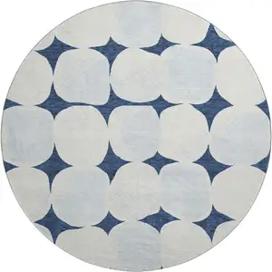 Photo of 8' Navy Blue And Ivory Abstract Geometric Washable Round Rug With UV Protection