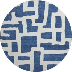Photo of 8' Navy Blue And Ivory Abstract Geometric Washable Round Rug With UV Protection