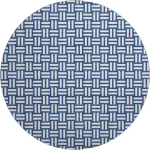 Photo of 8' Navy Blue And Ivory Abstract Geometric Washable Round Rug With UV Protection