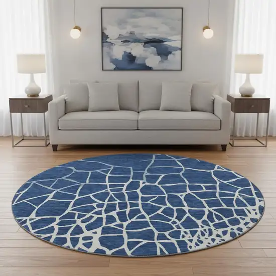 8' Navy Blue And Ivory Abstract Geometric Washable Round Rug With UV Protection Photo 2