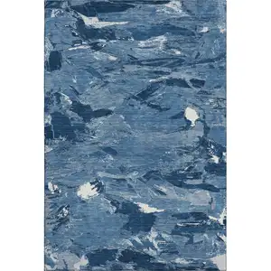 Photo of 8' Navy Blue And Ivory Abstract Washable Area Rug With UV Protection