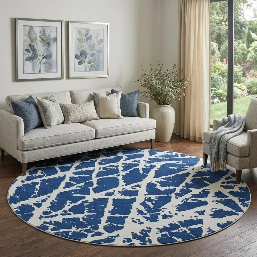 8' Navy Blue And Ivory Abstract Washable Round Rug With UV Protection Photo 1