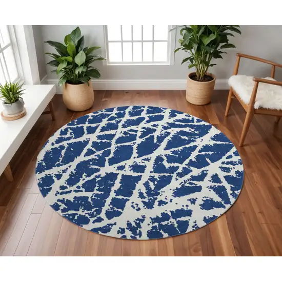 8' Navy Blue And Ivory Abstract Washable Round Rug With UV Protection Photo 2