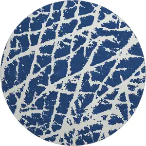 Photo of 8' Navy Blue And Ivory Abstract Washable Round Rug With UV Protection