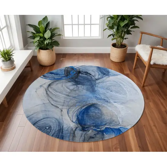 8' Navy Blue And Ivory Abstract Washable Round Rug With UV Protection Photo 2