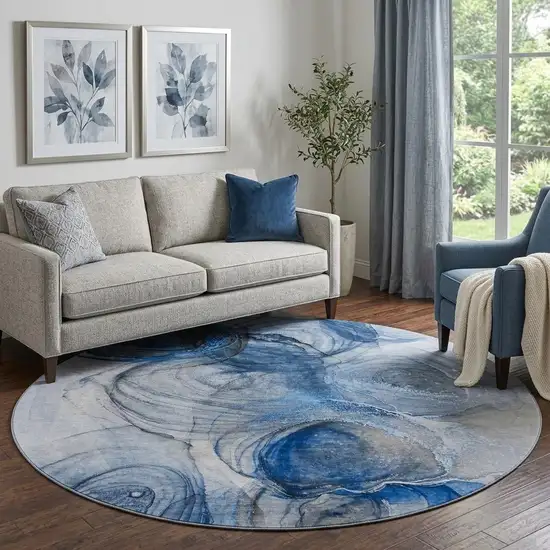 8' Navy Blue And Ivory Abstract Washable Round Rug With UV Protection Photo 1
