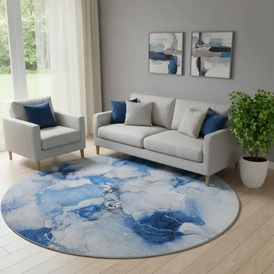 8' Navy Blue And Ivory Abstract Washable Round Rug With UV Protection Photo 1