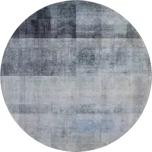 Photo of 8' Navy Blue And Ivory Abstract Washable Round Rug With UV Protection