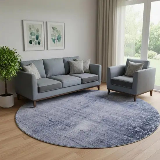 8' Navy Blue And Ivory Abstract Washable Round Rug With UV Protection Photo 1