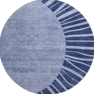 Photo of 8' Navy Blue And Ivory Abstract Washable Round Rug With UV Protection