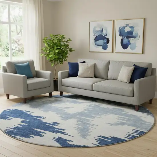 8' Navy Blue And Ivory Abstract Washable Round Rug With UV Protection Photo 1