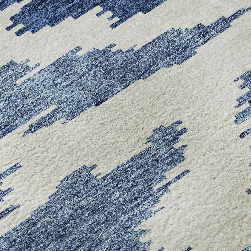 8' Navy Blue And Ivory Abstract Washable Round Rug With UV Protection Photo 9