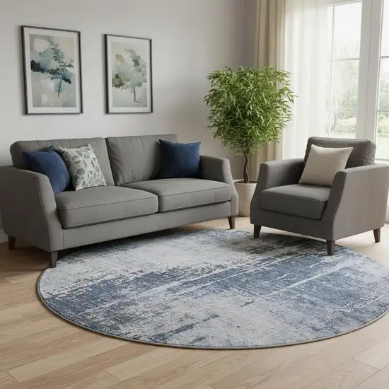 8' Navy Blue And Ivory Abstract Washable Round Rug With UV Protection Photo 1