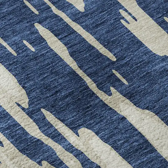 8' Navy Blue And Ivory Abstract Washable Round Rug With UV Protection Photo 8