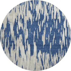 Photo of 8' Navy Blue And Ivory Abstract Washable Round Rug With UV Protection